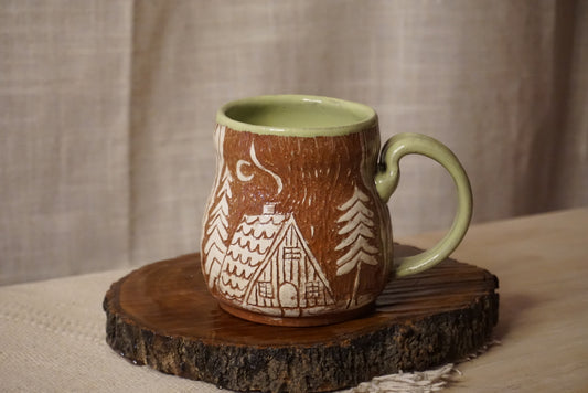 Cozy A-frame cabin mug